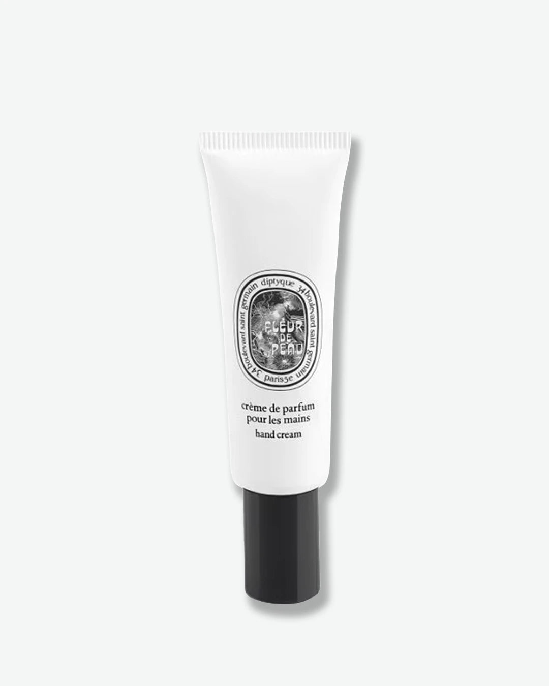 Hand cream tube with black and white design on a white background