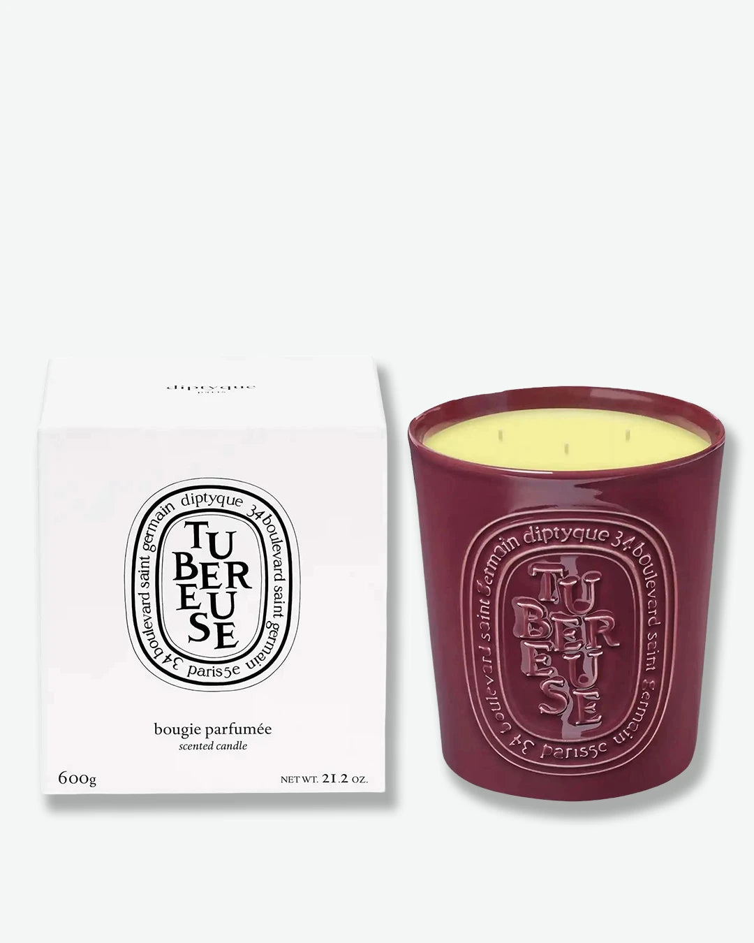 Diptyque tubereuse candle and packaging on a white background