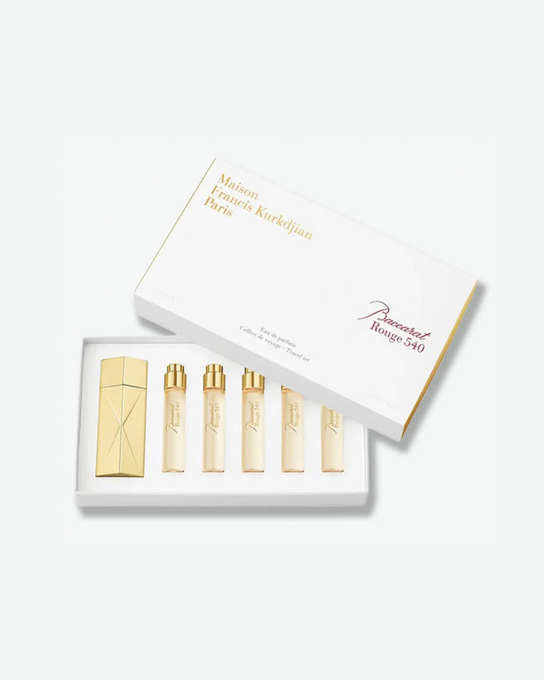 Set of gold perfume bottles in a white box with 'Maison Francis Kurkdjian' branding.