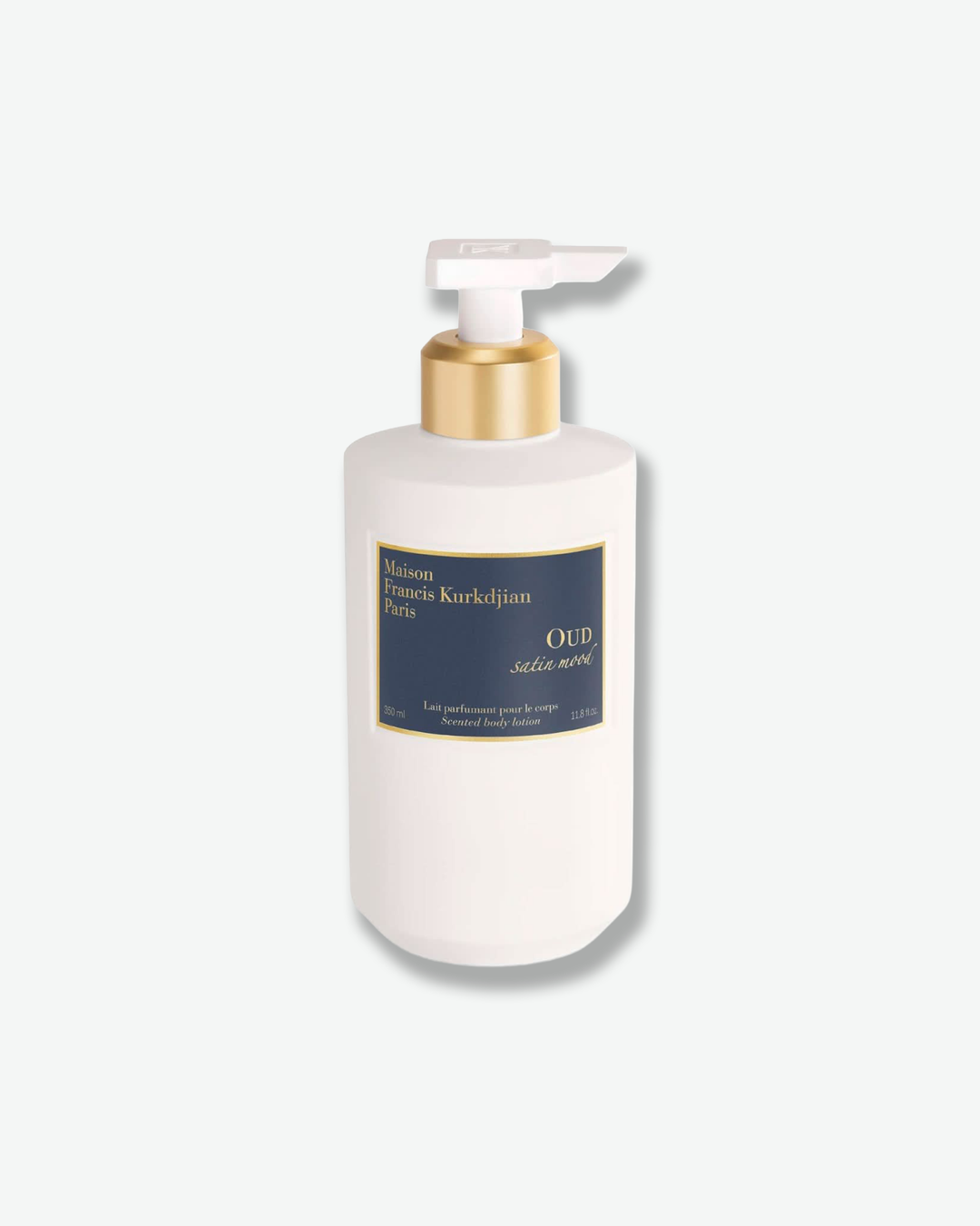 White bottle with pump and gold cap on a white background