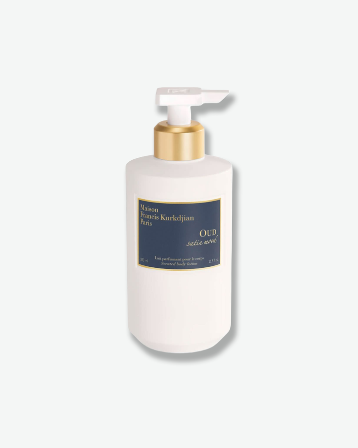 White bottle with pump and gold cap on a white background