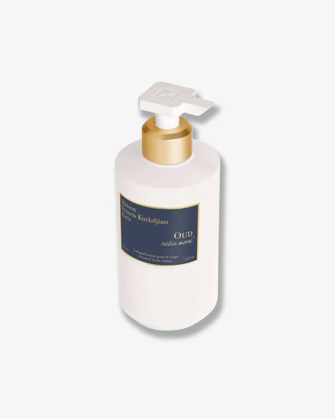 White bottle with gold pump and blue label on a white background
