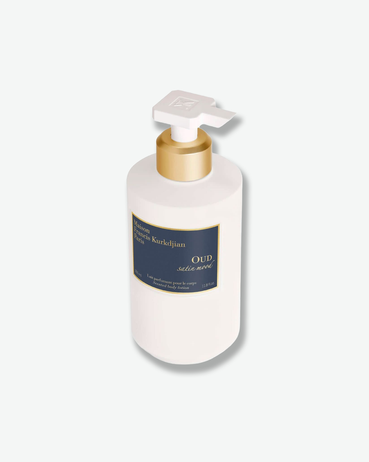White bottle with gold pump and blue label on a white background