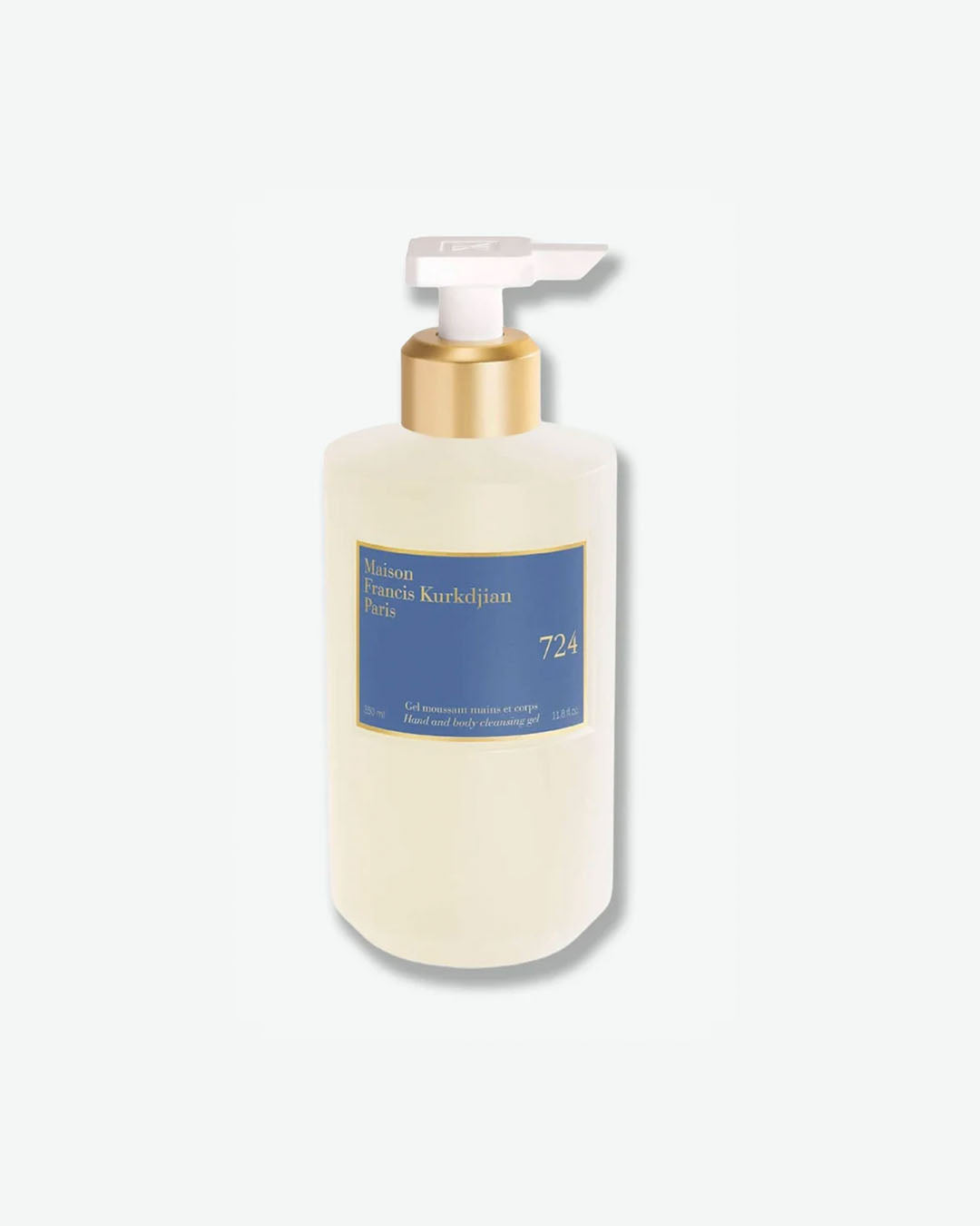 Front view of a translucent plastic pump bottle showing a light-colored liquid gel of Maison Francis Kurkdjian Paris "724" Hand and body cleansing gel (Gel moussant mains et corps) in a 350 ml size, featuring a blue and gold label with a gold and white pump mechanism.