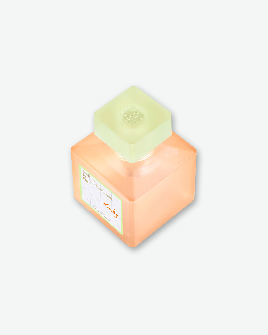 An elevated, three-quarter angled view of the square Maison Francis Kurkdjian Paris "Kurky" Eau Parfumée bottle. The shot highlights the translucent, frosted lime green square cap embossed with the brand's monogram logo on top.