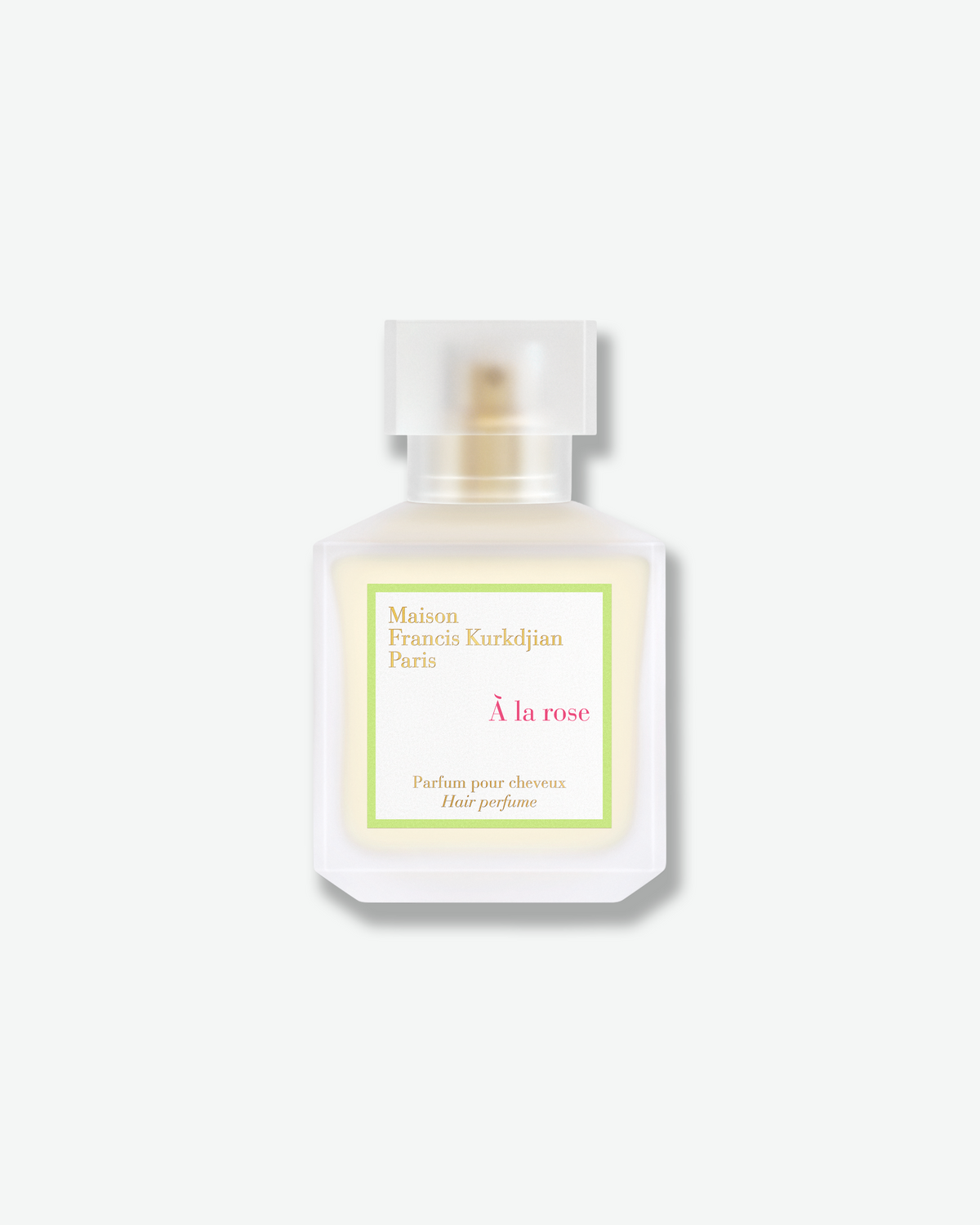 Maison Francis Kurkdjian À la rose Hair Perfume bottle in frosted glass with pink and green label.
