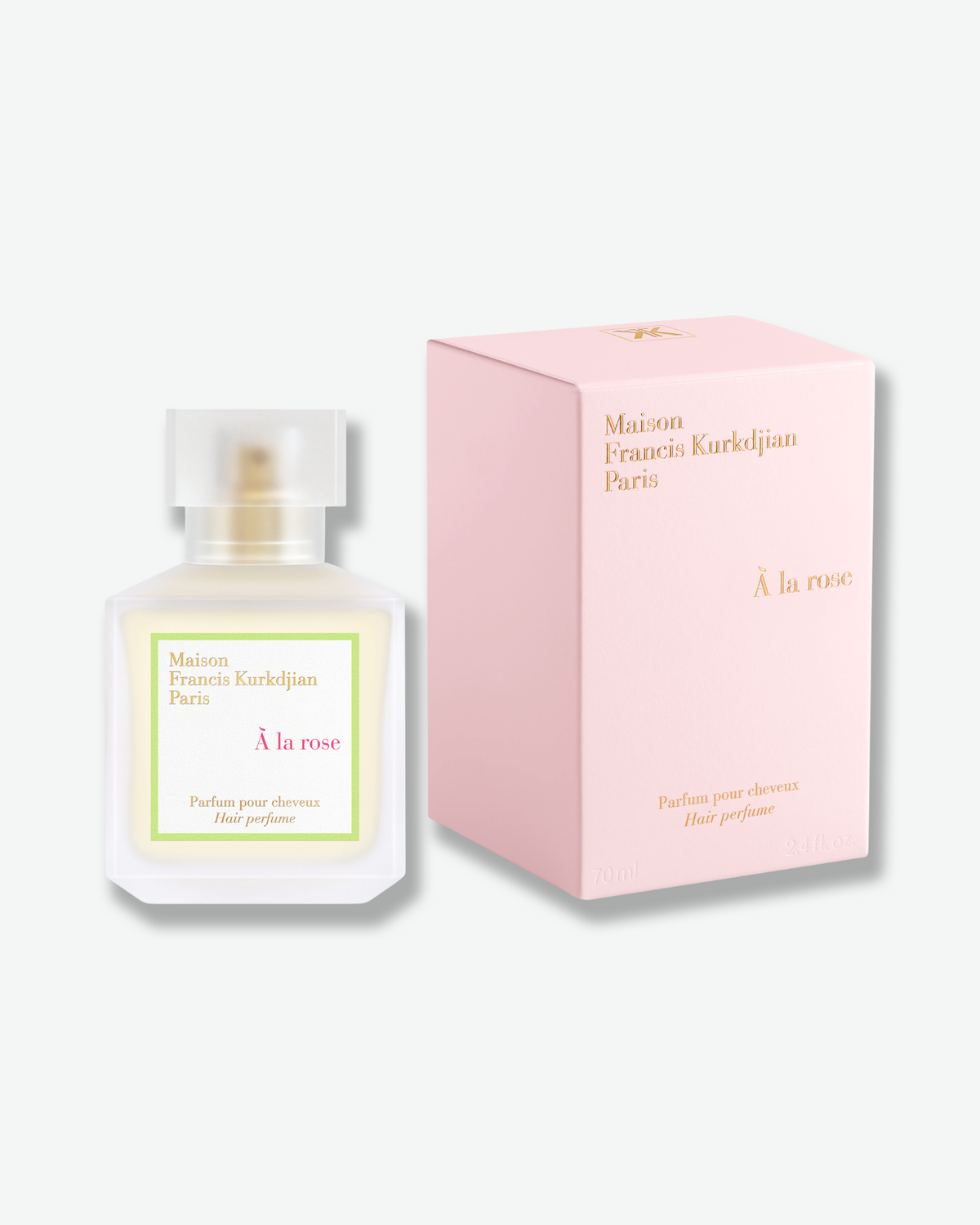 Maison Francis Kurkdjian À la rose Hair Perfume bottle displayed beside its blush pink box.