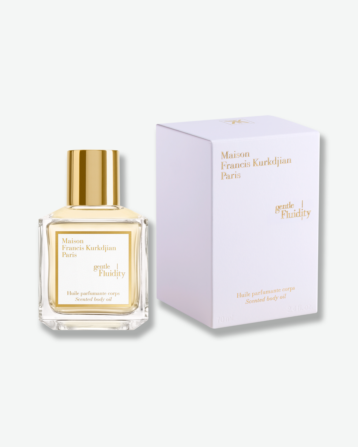 Maison Francis Kurkdjian Gentle Fluidity Scented Body Oil displayed beside its coordinating white-and-gold box.
