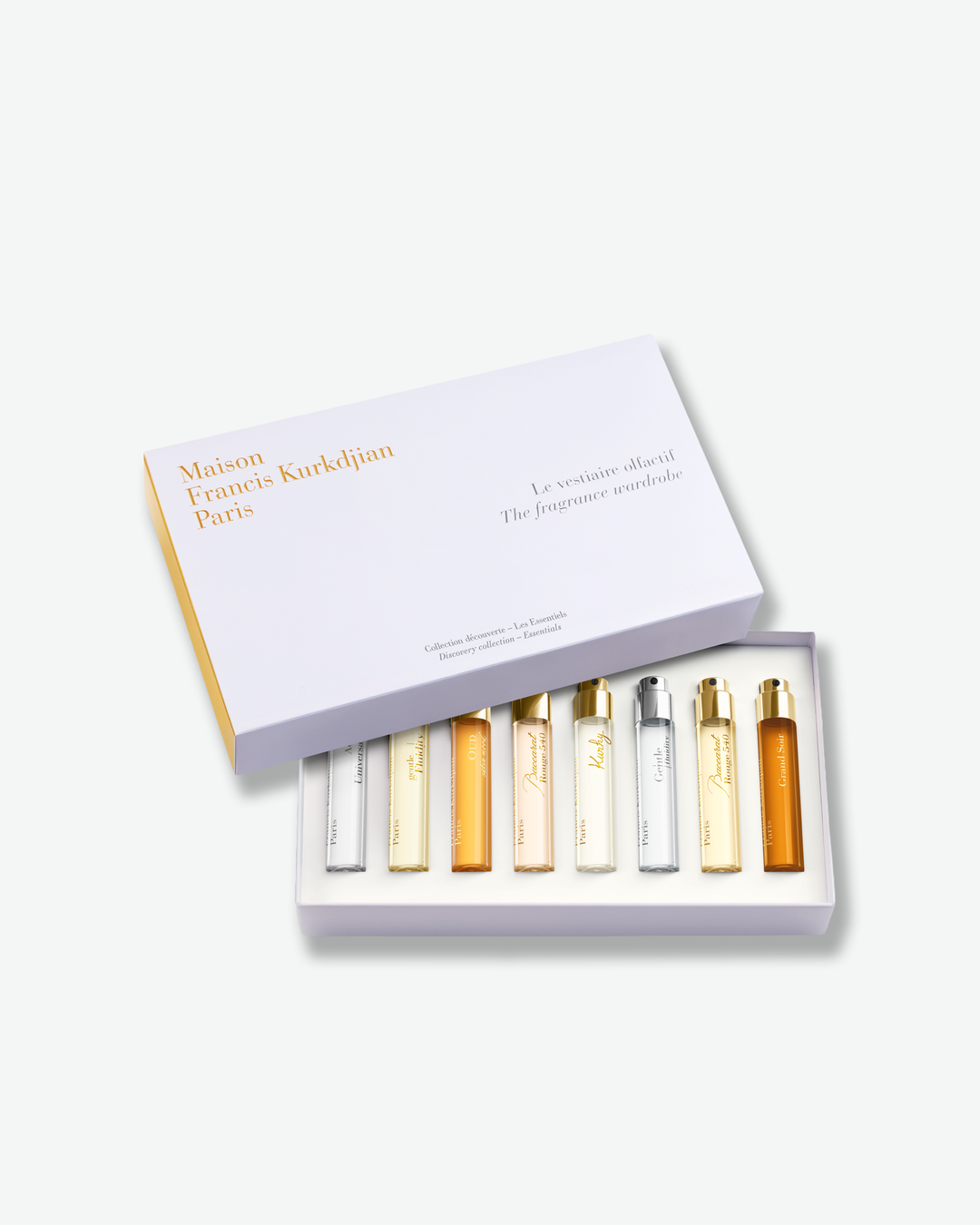 Set of miniature perfume bottles in a box with 'Maison Francis Kurkdjian' branding on a white background.