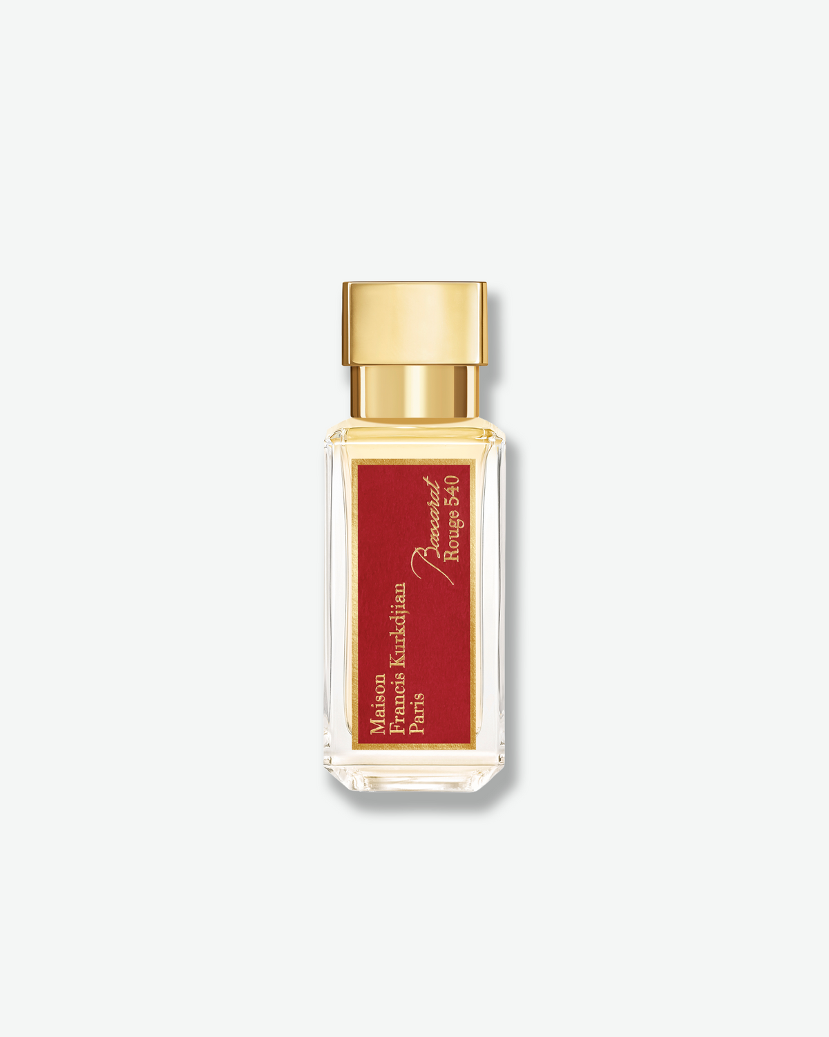 Maison Francis Kurkdjian Baccarat Rouge 540 eau de parfum in a clear glass travel-size bottle with a gold cap and signature red label.