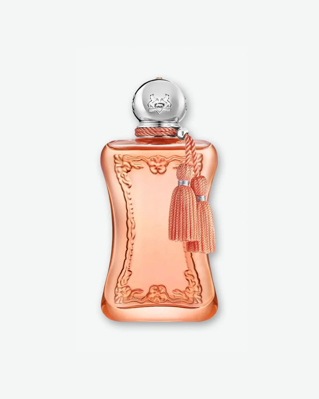 A studio product shot of a Parfums de Marly fragrance bottle against a light gray background. The translucent glass bottle is filled with a soft peach-pink perfume, featuring an elegant, curved hourglass silhouette adorned with raised baroque-style molding on the front. A spherical silver cap engraved with a horse crest sits on top, with a matching peach twisted cord wrapped around the neck that holds two decorative tassels.