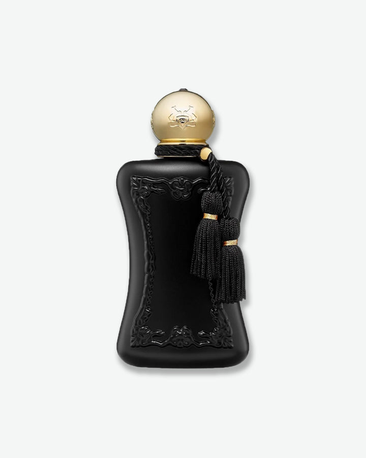 Black perfume bottle with gold cap and tassel on a white background