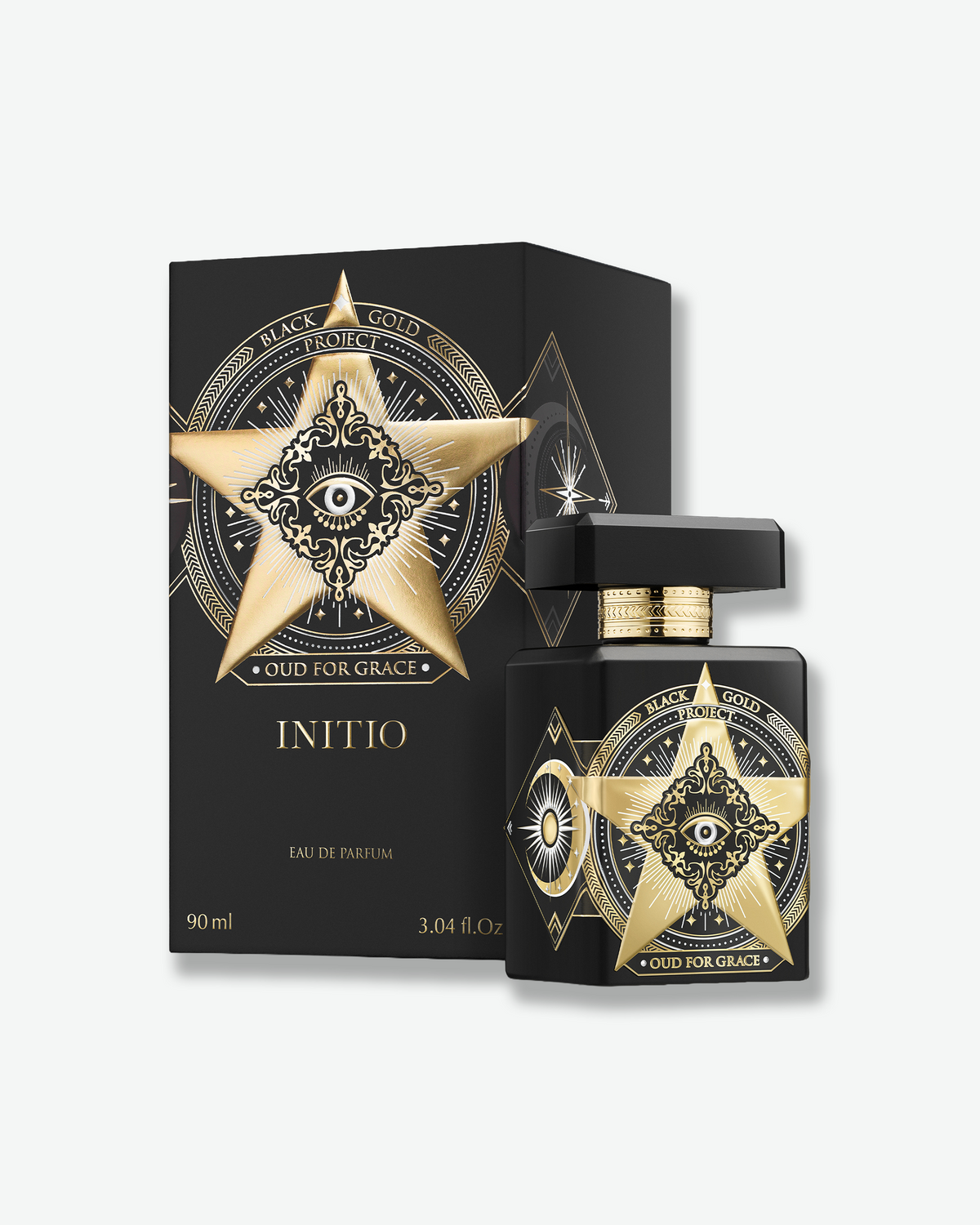 Initio Oud for Greatness Black Gold Project fragrance bottle displayed beside its matching black and gold box.