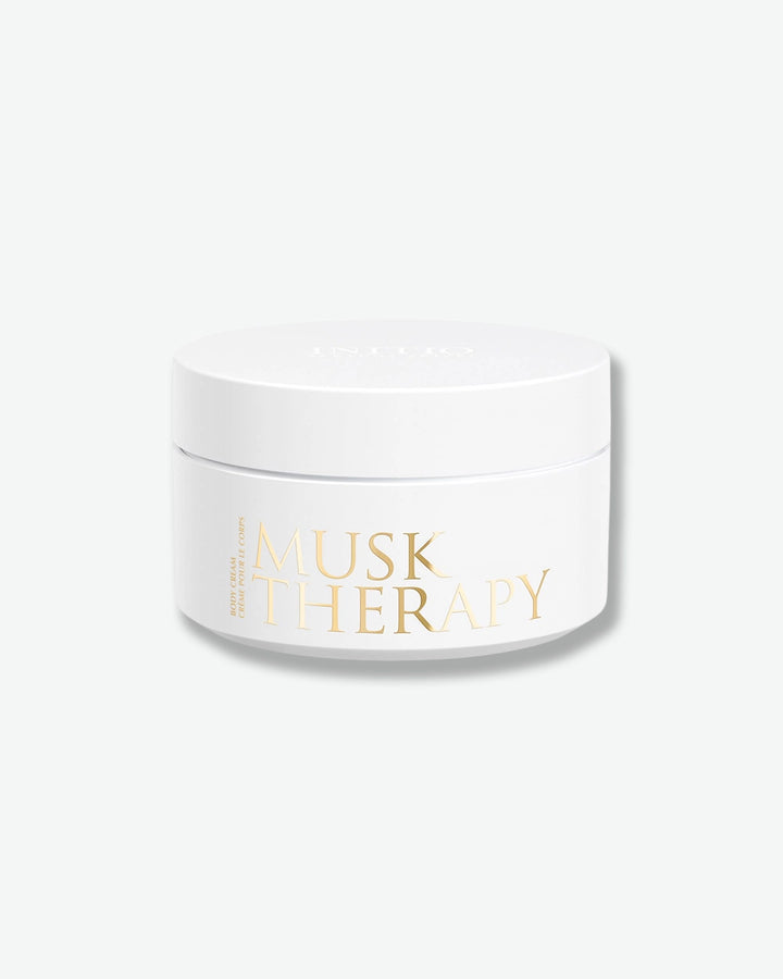 White jar with gold text on a white background