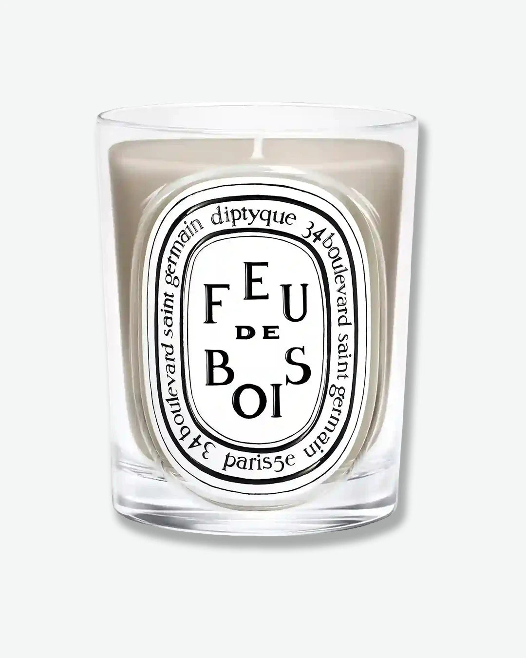 Diptyque candle labeled 'Feu de Bois' on a white background