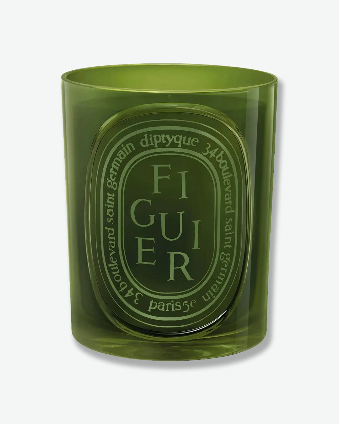 Green candle with Diptyque branding on a white background