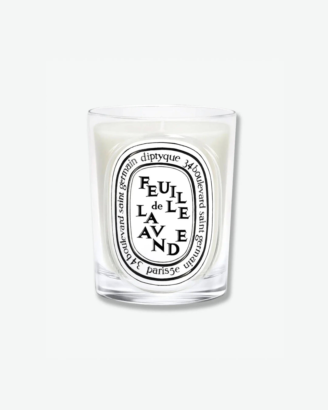 Diptyque Feuille de Lavande scented candle in a classic clear glass jar featuring the signature white oval logo with black lettering, isolated on a light grey background.