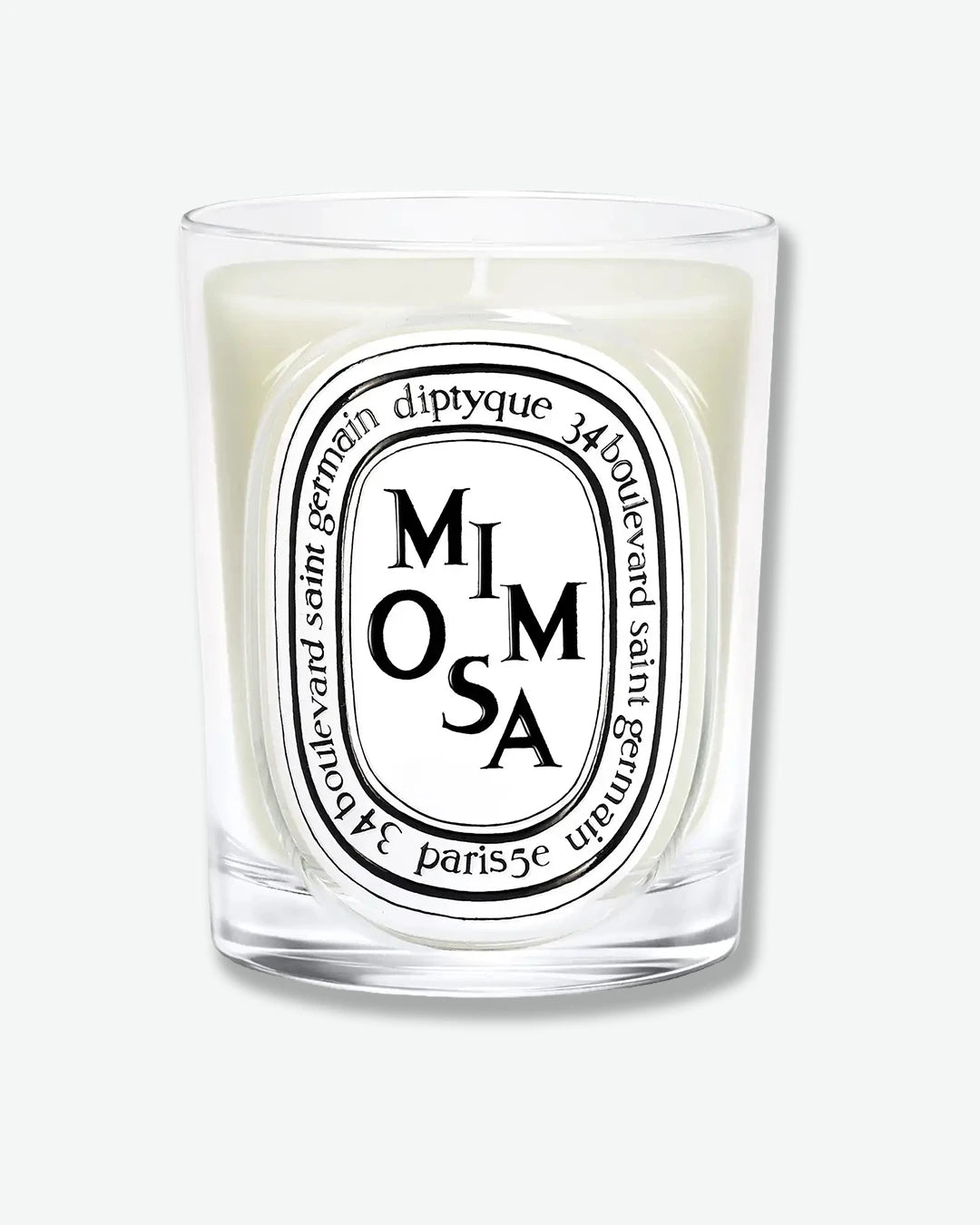 Diptyque Mimosa candle on a white background