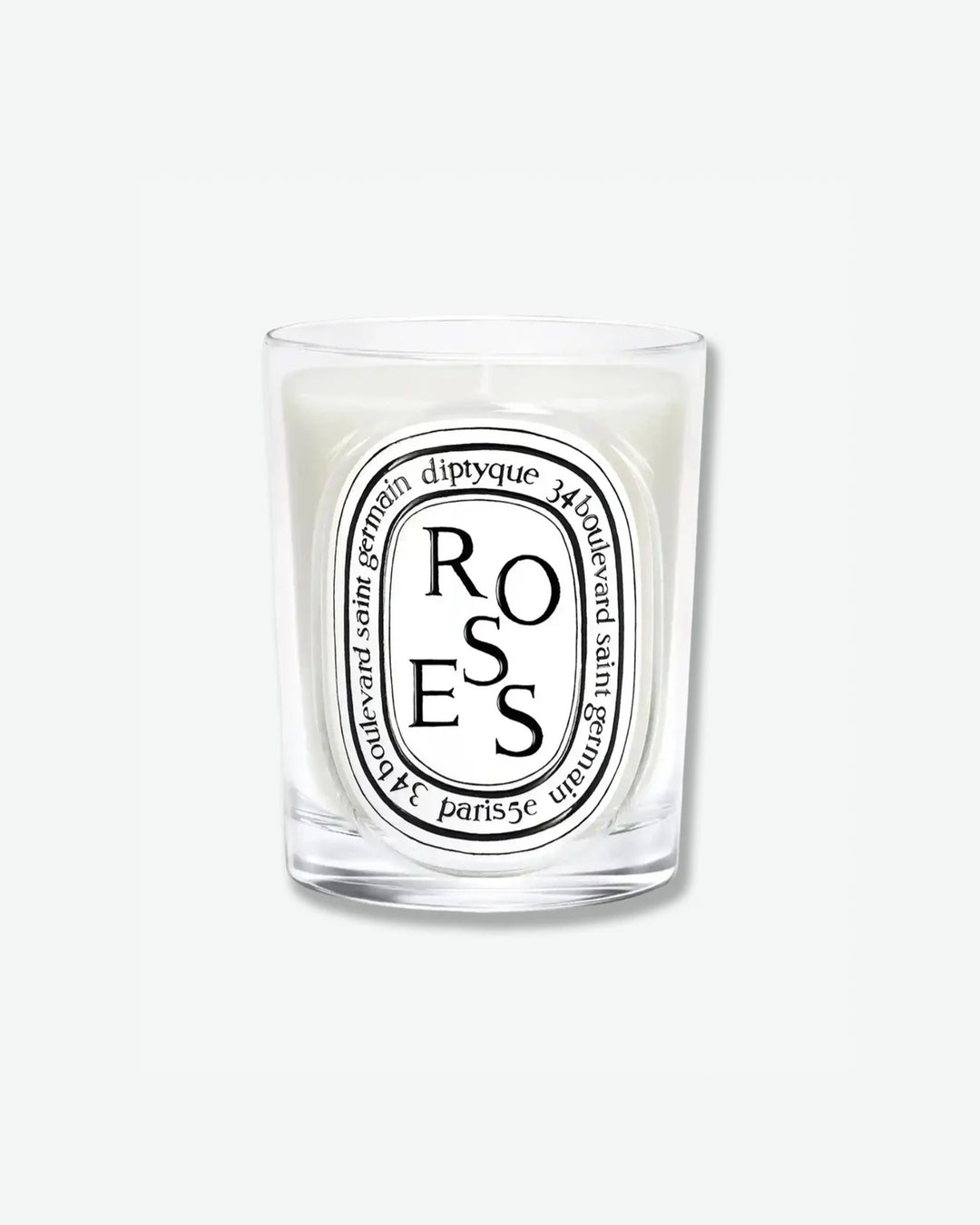 Diptyque Roses scented candle in a classic clear glass jar featuring the signature white oval logo with black lettering, isolated on a light grey background.