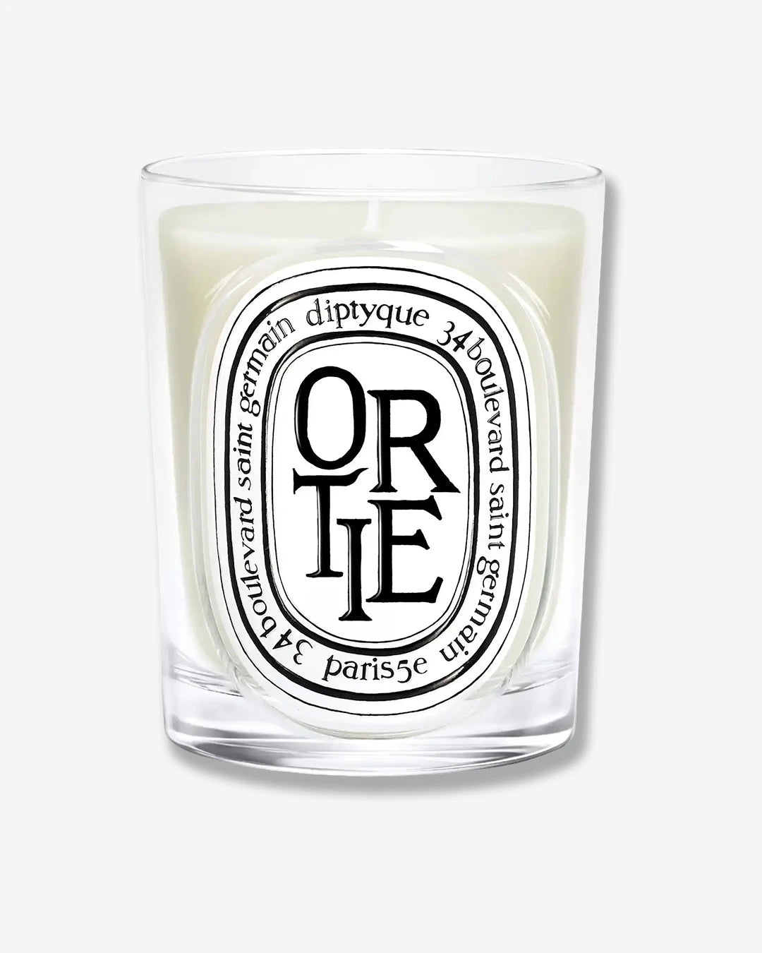 Diptyque candle with 'Ortie' label on a white background