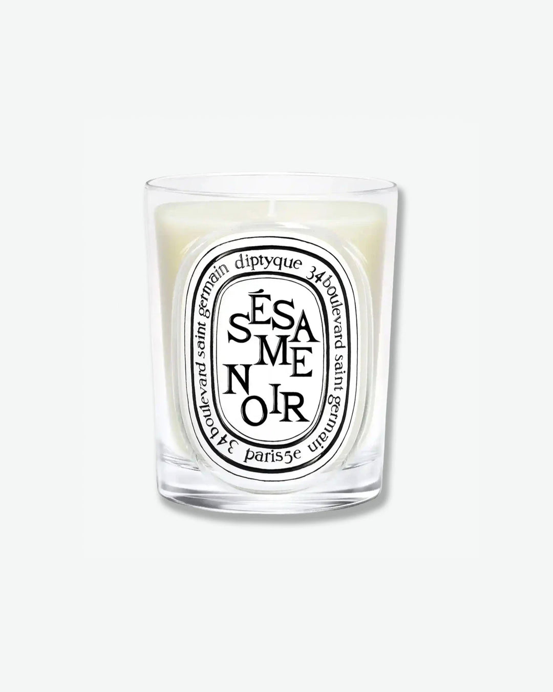 Diptyque Sésame Noir scented candle in a classic clear glass jar featuring the signature white oval logo with black lettering, isolated on a light grey background.