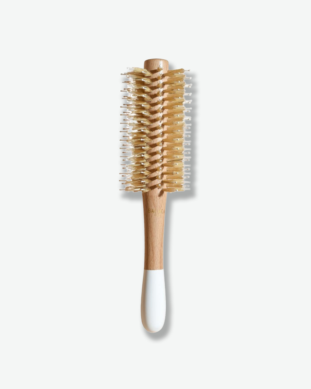 Hairbrush with wooden handle and bristle head on a white background