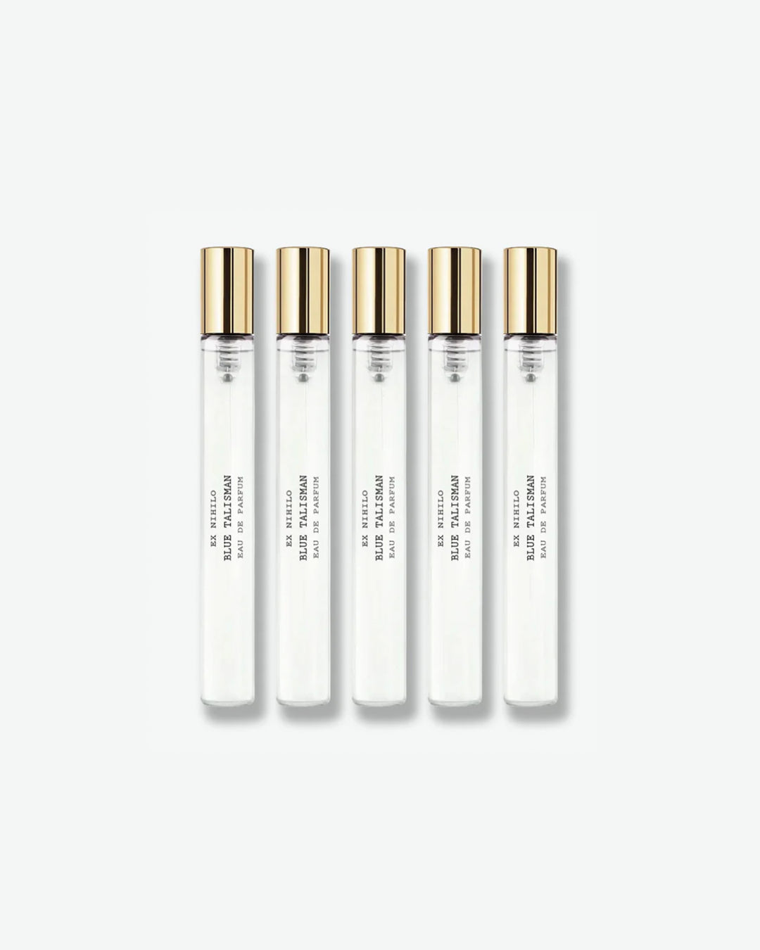 A set of five identical Ex Nihilo Blue Talisman Eau de Parfum travel spray vials with clear glass bodies and gold caps, arranged vertically against a light grey background.