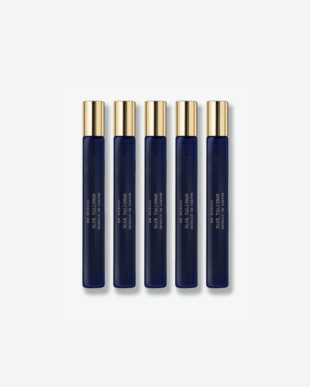 A set of five identical Ex Nihilo Blue Talisman Extrait de Parfum travel spray vials featuring sleek, translucent deep blue glass tubes and polished gold caps, isolated on a light grey background.