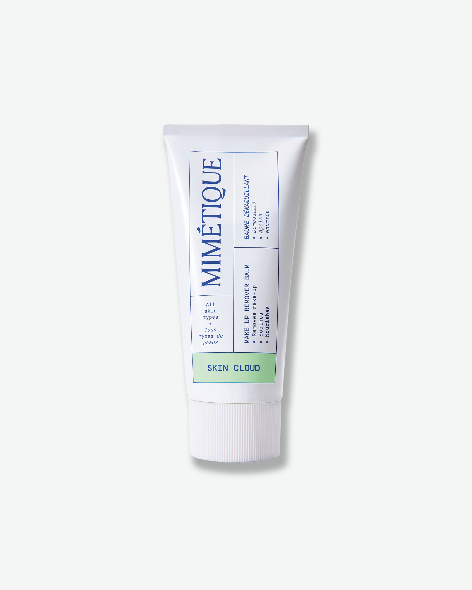 A white squeeze tube of Mimétique All Skin Type Remix Balm with blue and green text, centered on a light gray background.