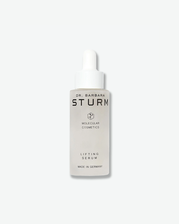 A product shot of a Dr. Barbara Sturm Lifting Serum bottle, centered against a light gray background. The frosted glass bottle contains a slightly translucent liquid and is fitted with a white rubber dropper cap. The text on the front reads "DR. BARBARA STURM", the molecular hexagon logo, "MOLECULAR COSMETICS", "LIFTING SERUM", and "MADE IN GERMANY".