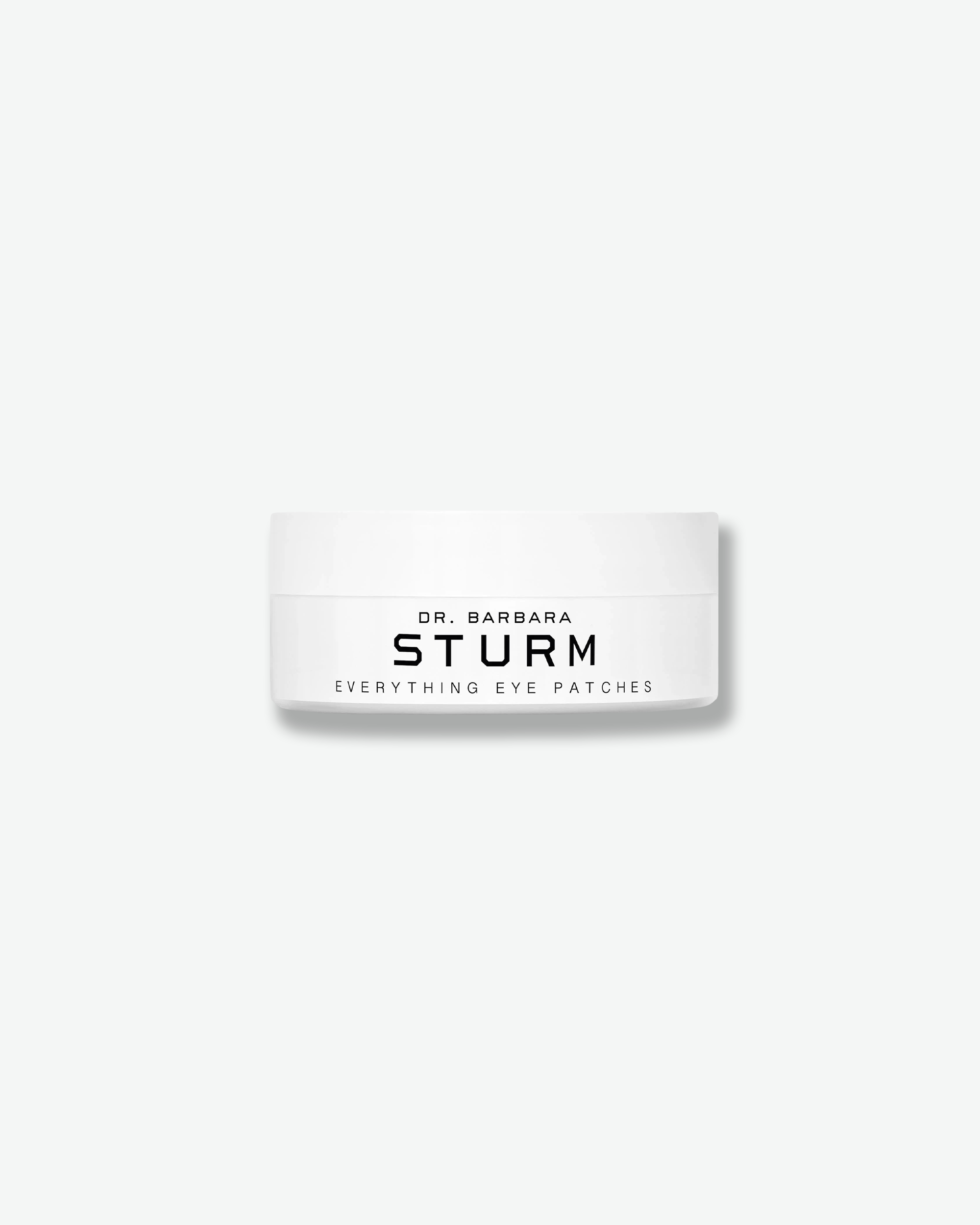 Front view of a low, wide Dr. Barbara Sturm Everything Eye Patches jar against a plain gray background. The white container features the brand name and the words "EVERYTHING EYE PATCHES" printed in minimalist black font, topped with a matching flat white cap.