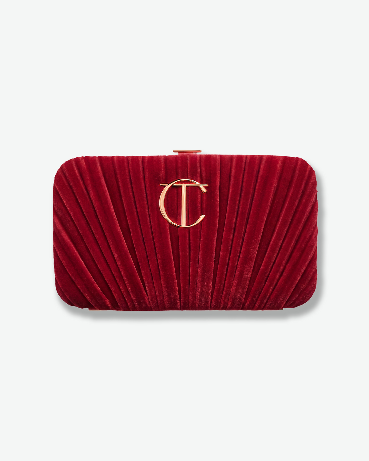 Red velvet Charlotte Tilbury clutch with gold CT logo.
