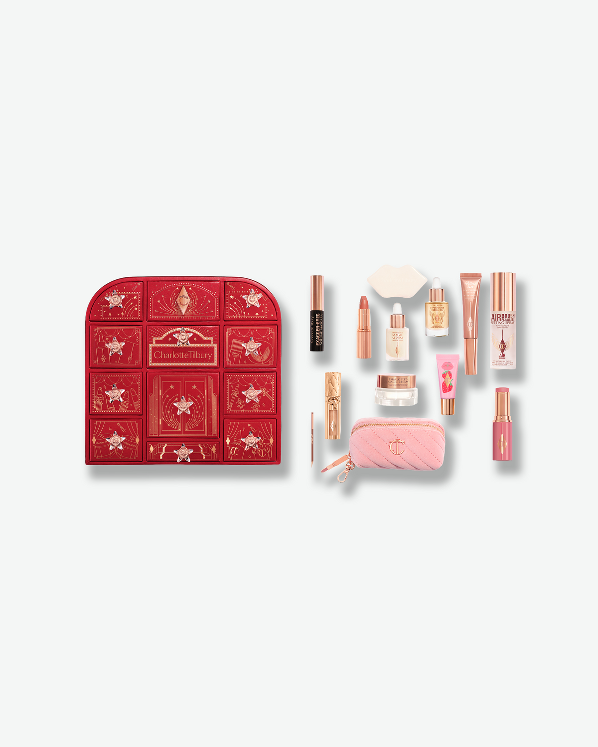 Charlotte Tilbury Beauty Treasure Chest of Love advent calendar displayed with a curated selection of makeup and skincare products, including lipstick, mascara, serum, setting spray, and a pink makeup bag.