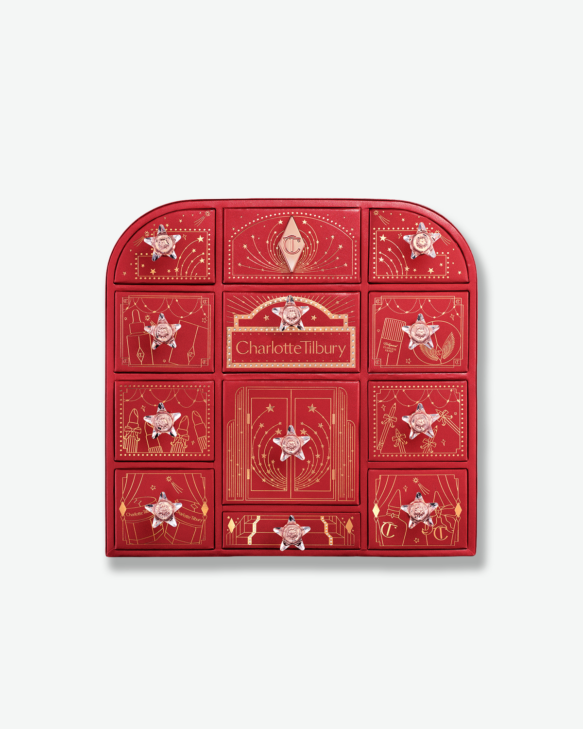 Charlotte Tilbury Beauty Treasure Chest of Love advent calendar in red and gold packaging with decorative drawers and crystal star-shaped handles.
