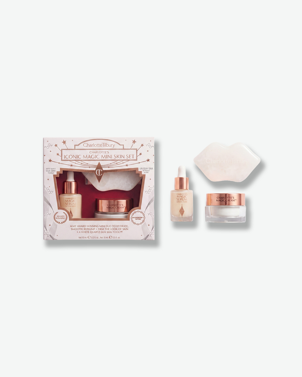 Charlotte Tilbury Charlotte’s Iconic Magic Mini Skin Set featuring Magic Serum Crystal Elixir, Magic Cream, and a white quartz gua sha tool.