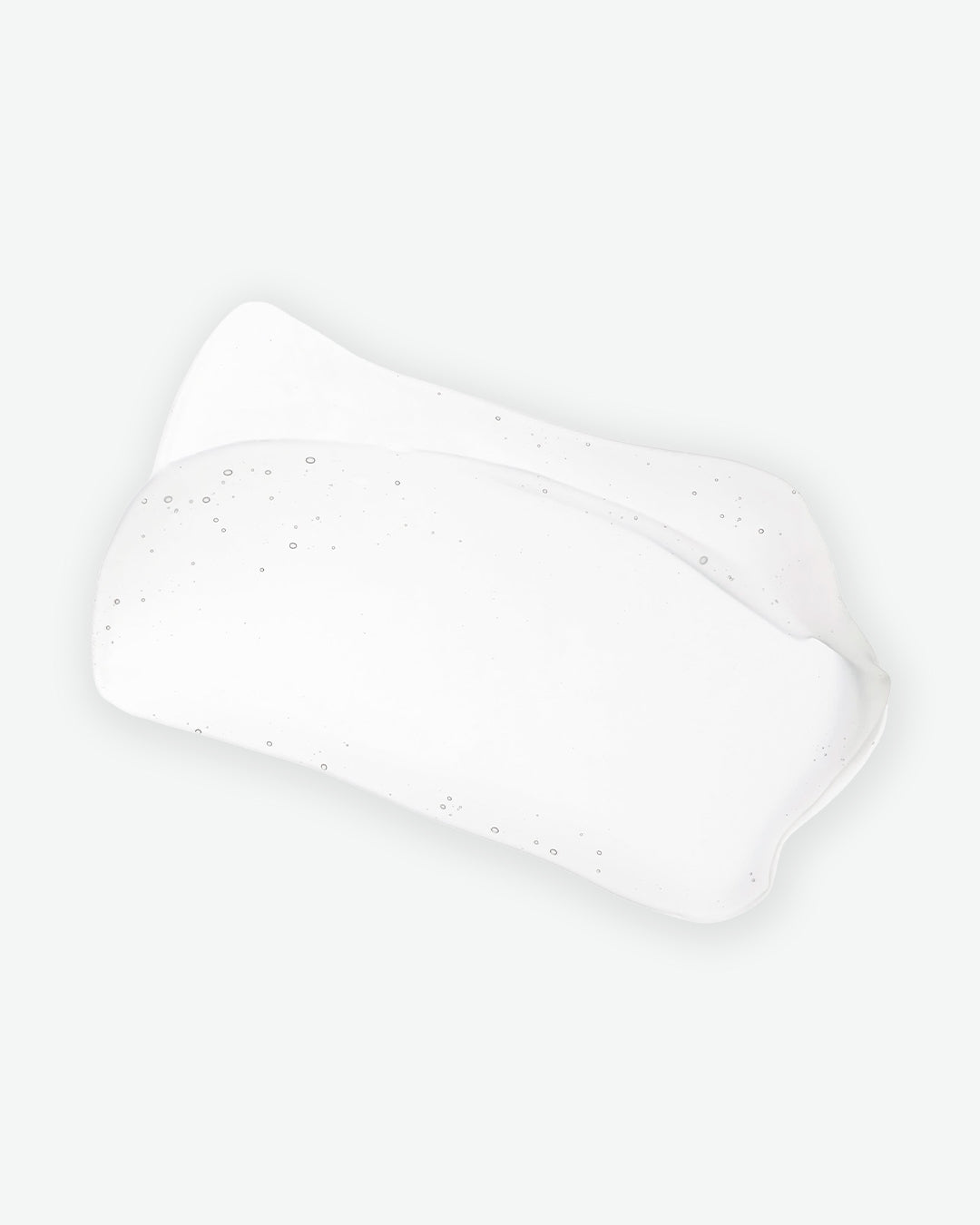White rectangular sponge on a white background