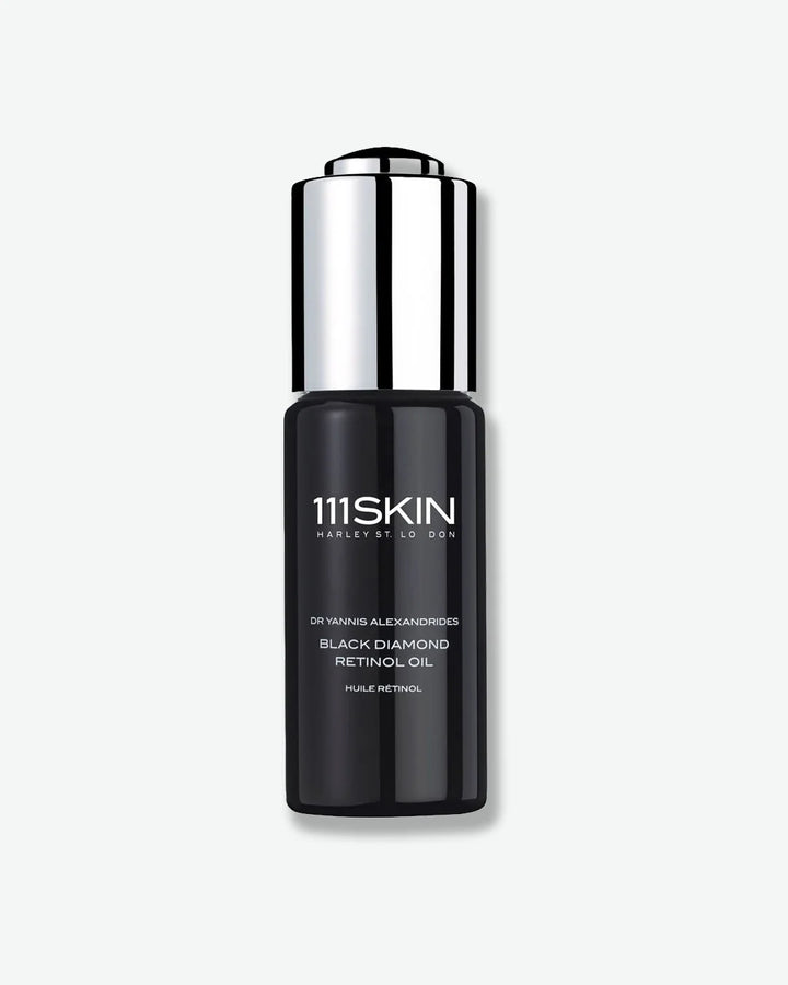 Black skincare bottle of 111Skin Black Diamond Retinol Oil with silver cap on a white background