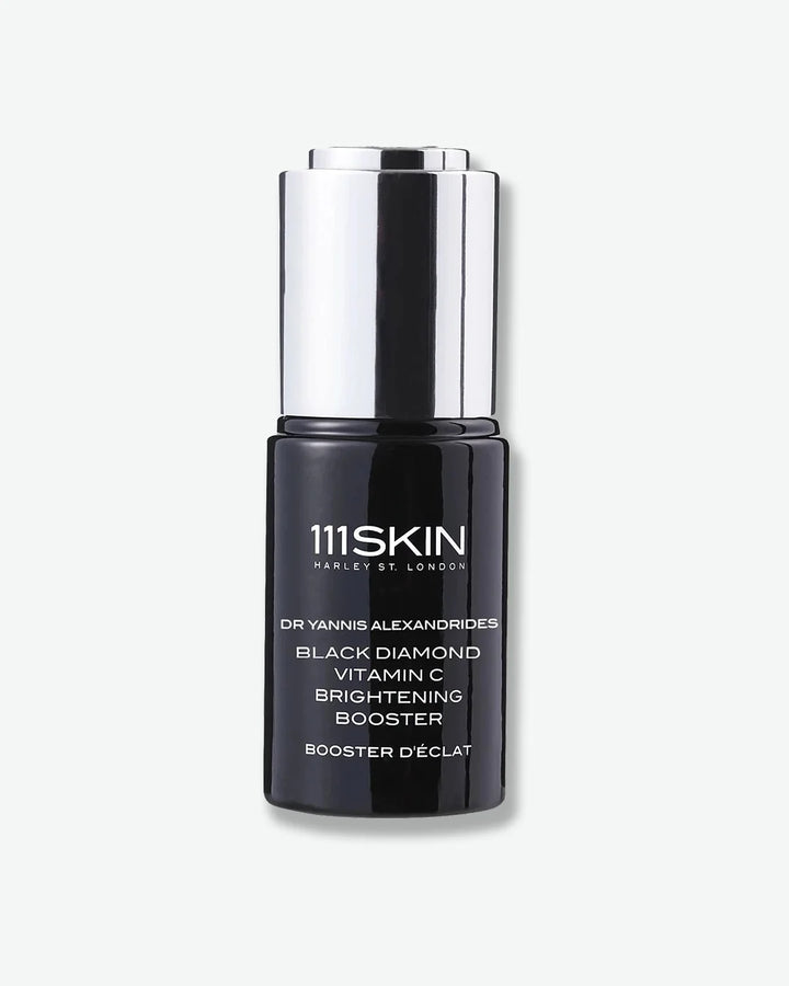 Black bottle of 111SKIN Black Diamond Vitamin C Brightening Booster with a silver cap on a white background