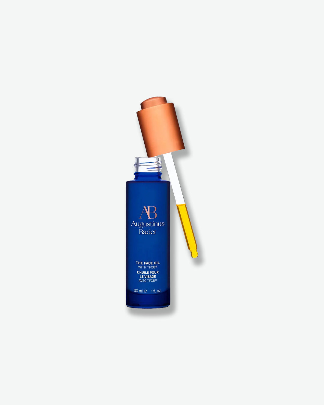Blue skincare bottle with dropper on a white background