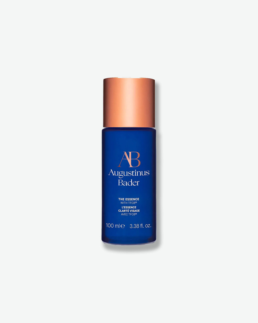 Blue skincare bottle with copper cap on a white background
