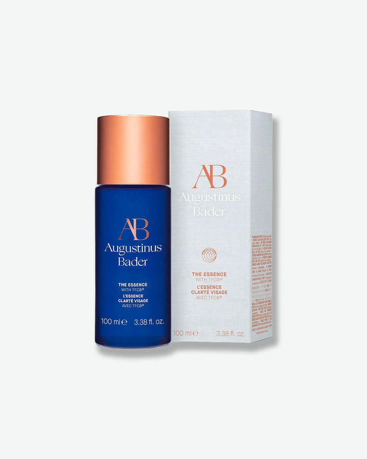 Augustinus Bader skincare product with blue bottle and white box on a light gray background