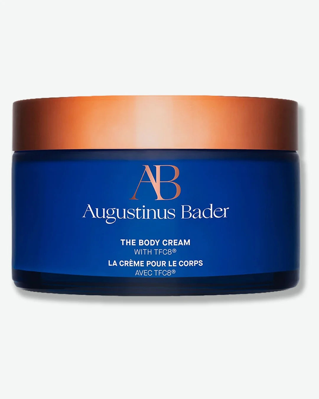 Augustinus Bader The Body Cream jar with blue body and copper lid on a white background