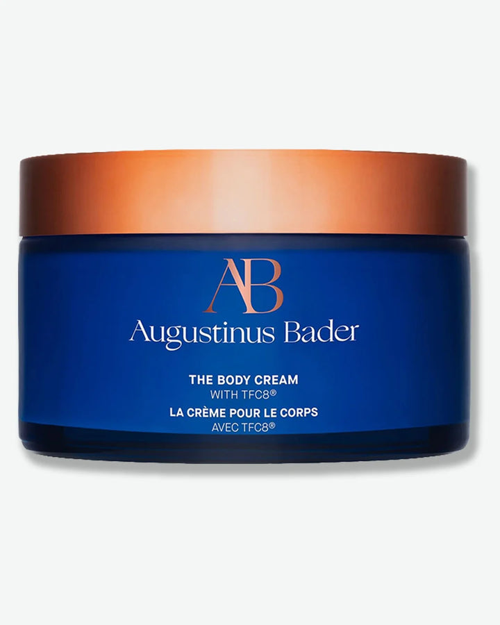 Augustinus Bader The Body Cream jar with blue body and copper lid on a white background