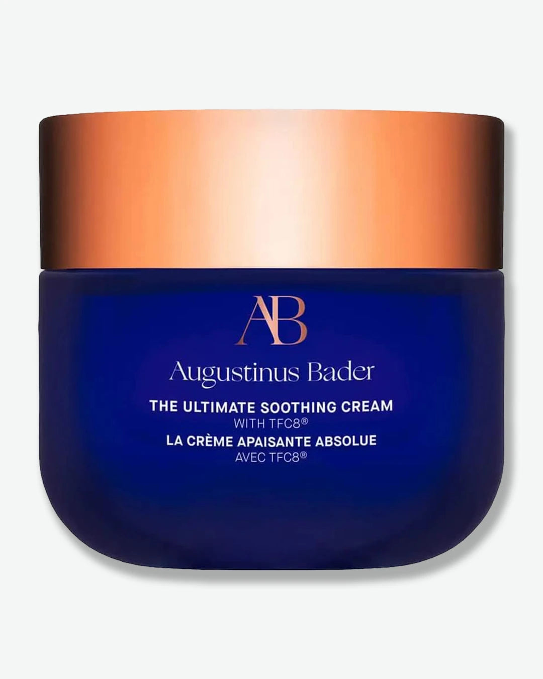 Augustinus Bader The Ultimate Soothing Cream jar with blue body and bronze lid on a white background