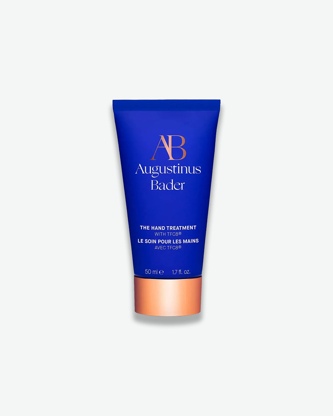 Blue tube of Augustinus Bader hand treatment on a white background