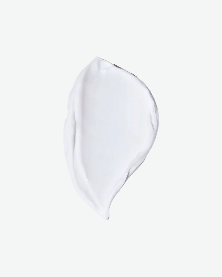 Clear glass teardrop-shaped object on a white background