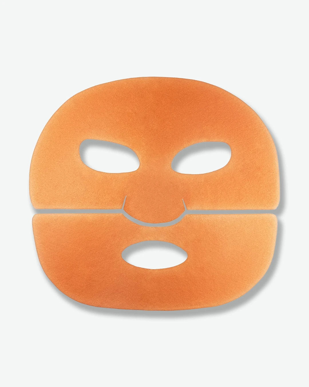 Orange face mask with cutouts on a light gray background