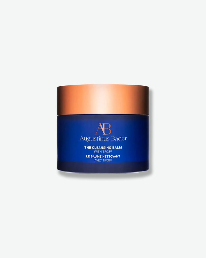 Augustinus Bader The Cleansing Balm jar with blue and bronze design on a white background