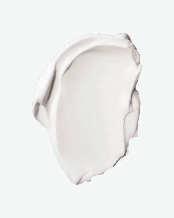 White cream swatch on a light beige background