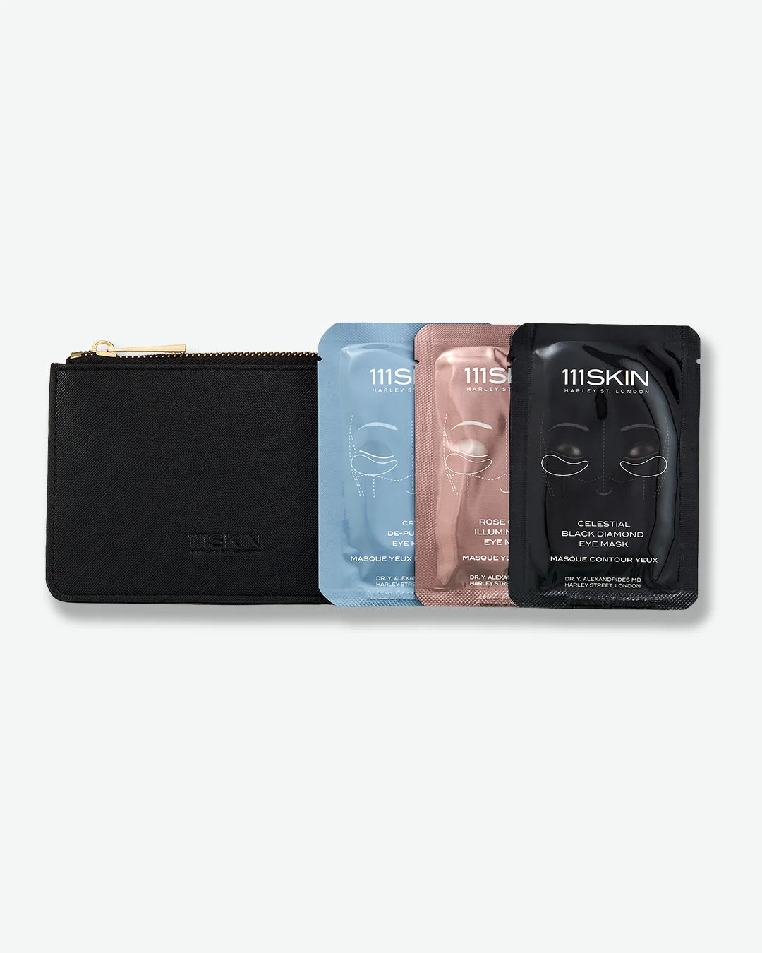 Set of 3 skincare masks - one blue, pink, and black stood next to a black pouch with zipper on a white background